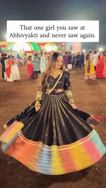 Black and rainbow chaniya choli at a garba event