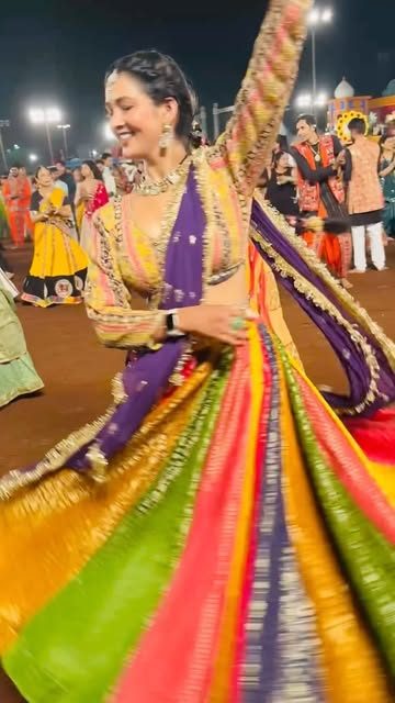 Rainbow chaniya choli mid-twirl