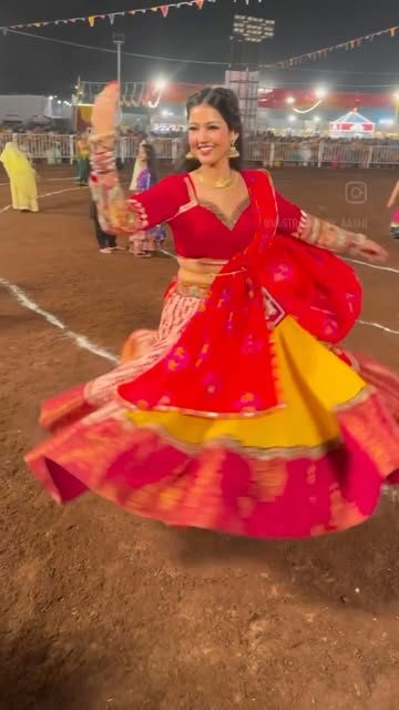Red mirror-work chaniya choli at a garba night